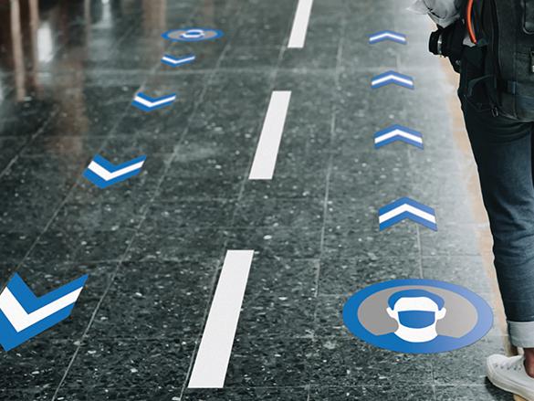 Social distancing symbols on ground