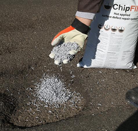Chipfill scattered coppers in road hole