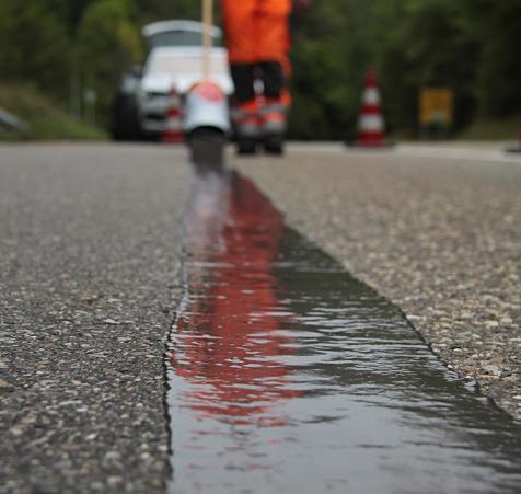Coldfill applied with screed to repair cracks in roads