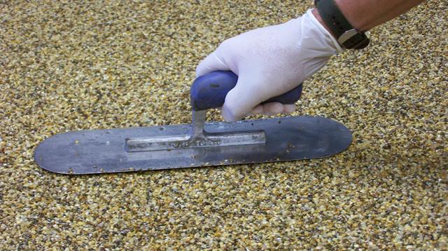 Application of resin bound surfacing with a squeegee