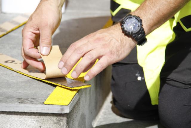 Anti-slip ROKI MX adhesive flat profile on stairs